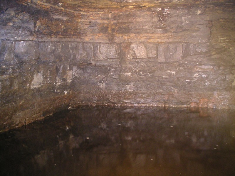 cch_concretedampool.jpg - Behind the dam, this flooded sump could be seen. It was not possible to capture, but the chamber is rectangular.