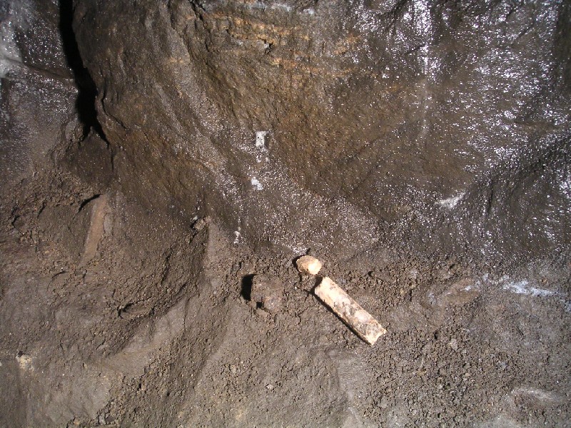 middleflat.JPG - A broken stick of dynamite in the Middle Flats. The whole area seems to be littered with them, on the side of passages or placed in knucks and crannies.