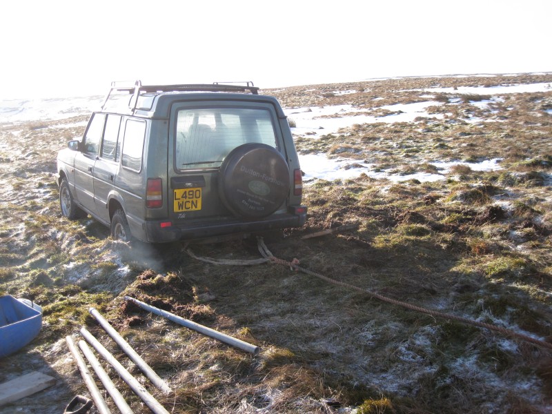 IMG_2726.jpg - Student Pete's Landy stuck in the not so frozen fellside.