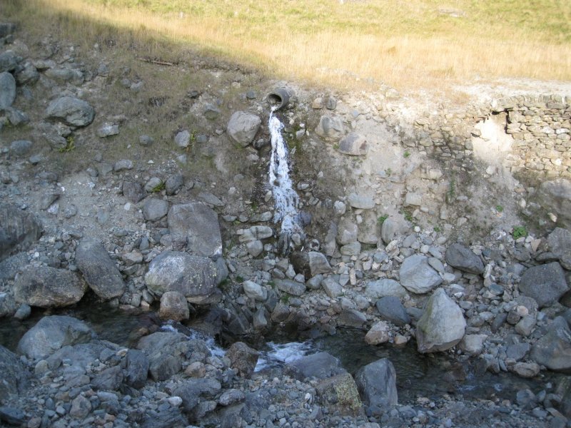 calcifiedoutflowpipe.jpg - Calcified tailings drainage pipe on the east bank.