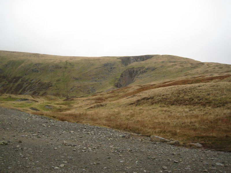 mountaincollapse.jpg - View of the mountain from the High Mill site. On OS maps now, the pits are marked as quarries, these are in fact collapsed stopes from inside the Greenside Mine workings.