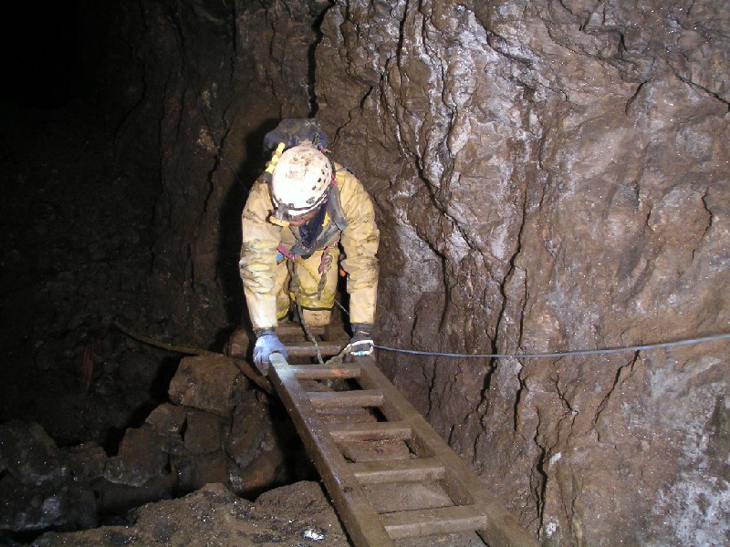ghg_doublesumpcrossing.jpg - Mark doing his Indiana Jones bit, crossing the second part of the sump along the ladders.