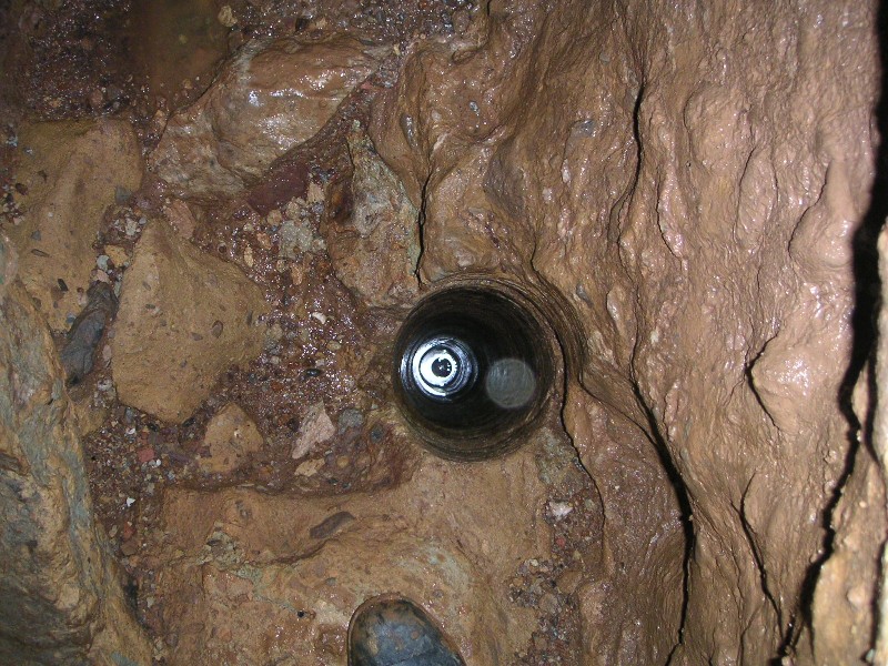 sr_shakinggulborehole1.jpg - The bore hole in Shaking Gulf located on the ledge, looking down into it.