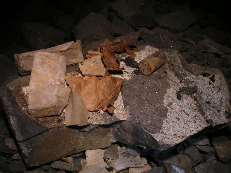 sc_topof_sc_flats_dynamiteboxes3.jpg - Remains of the dynamite boxes and wrappers.