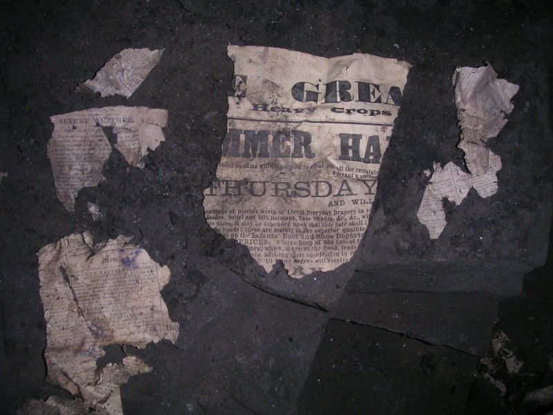 sc_topof_sc_flats_newspaper1.jpg - The old pieces of newspaper and the remains of what looks like a poster.