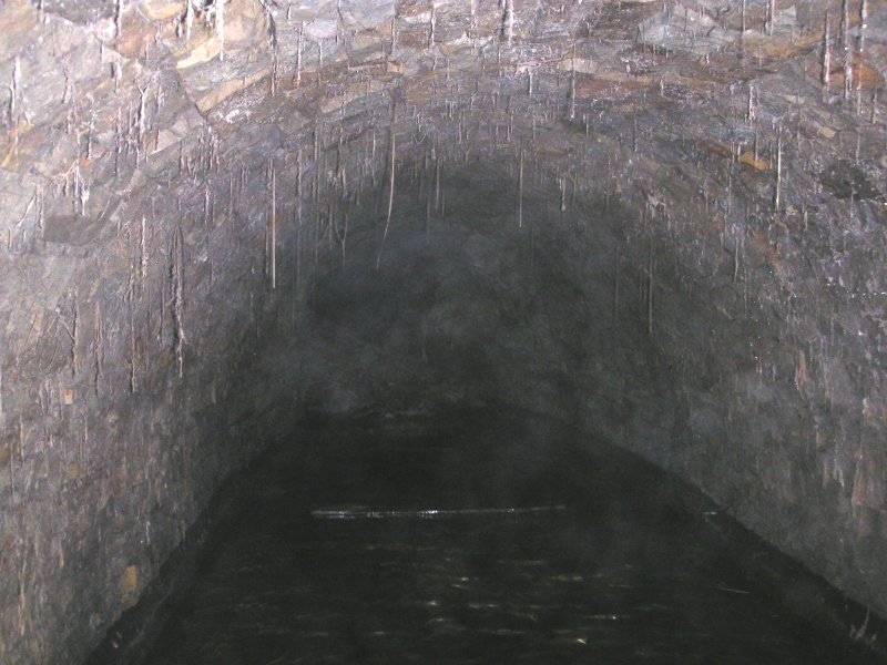 Pict0020.jpg - One end of the Capelcleugh passage we dropped down into, if you look carefully you can see a piece of wood floating and the collapse. The air in here was not to good.