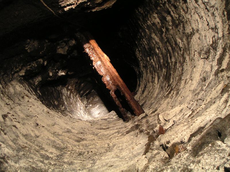 rg_bottomofshaft1.jpg - Looking up the shaft from Rampgill Level. We descended the left hand partition, the right side was blocked just past the second sub level and was raining down mud and stones - not a place to hang around under.